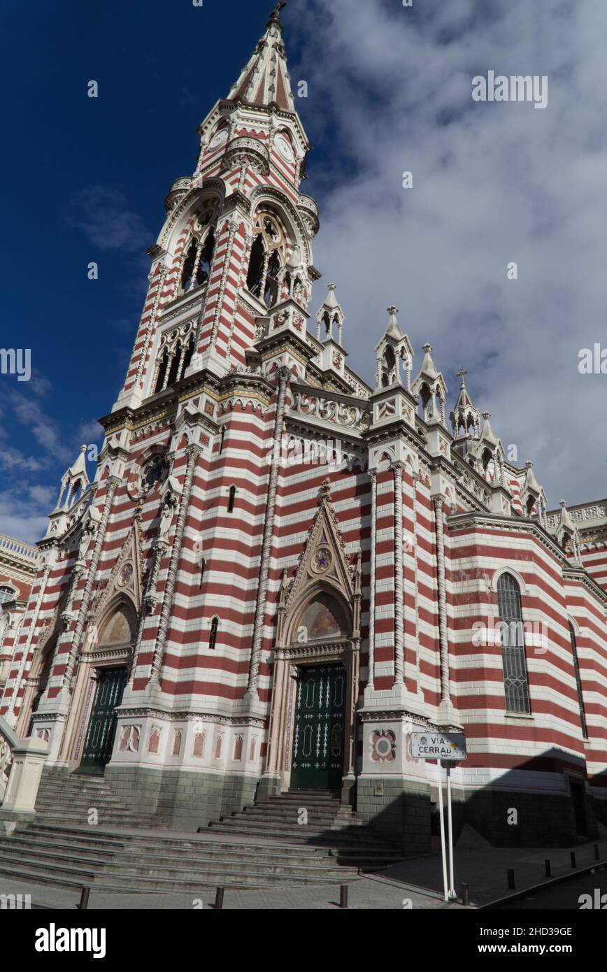 Vertical shot of Iglesia del Carmen church against a blue cloudy sky in Bogota, Colombia Stock Photo