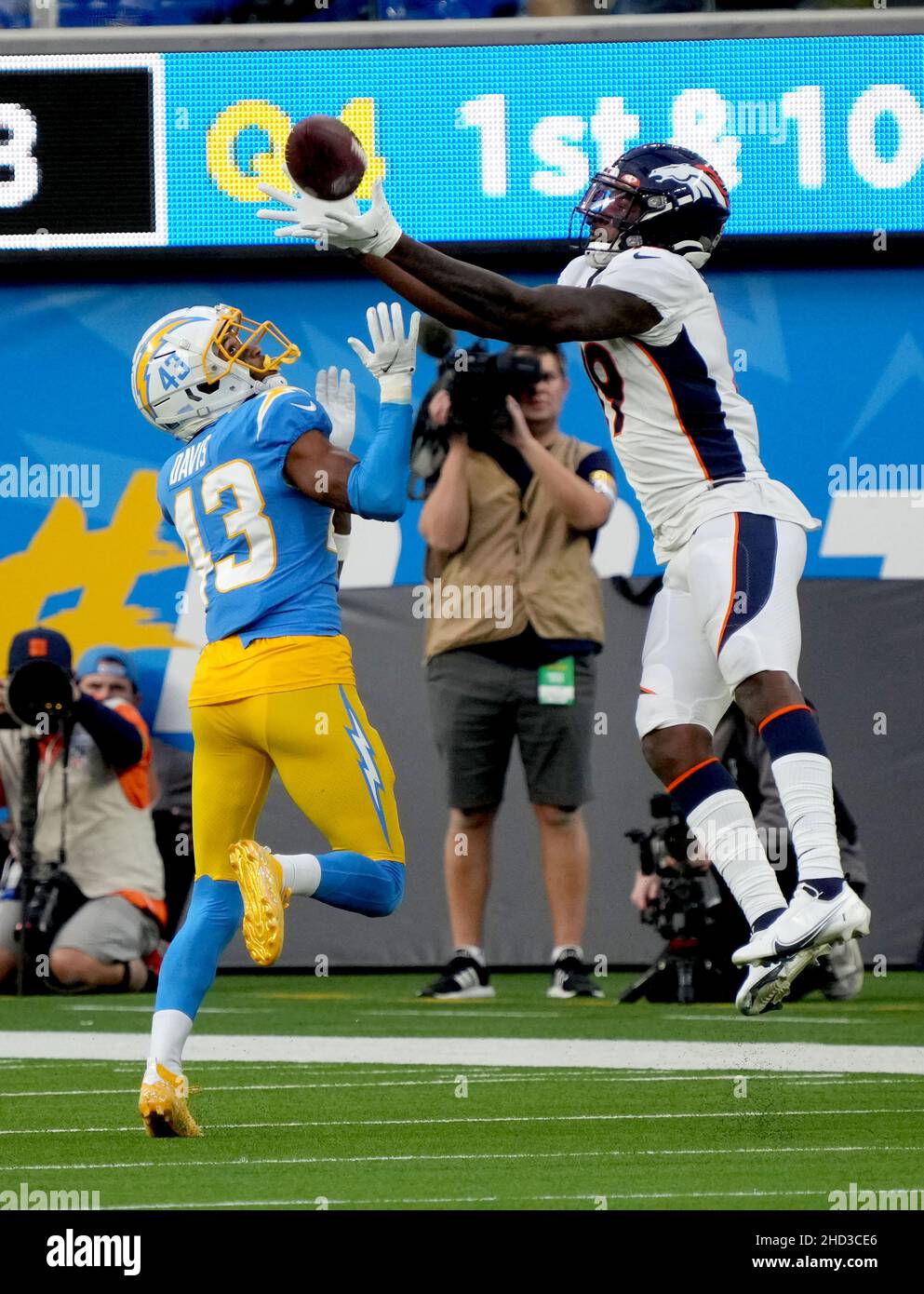 Inglewood, United States. 02nd Jan, 2022. Broncos receiver Seth Williams  hauls in a 34 yard pass against Chargers cornerback Michael Davis in fourth  quarter action at SoFi Stadium on Sunday, January 2