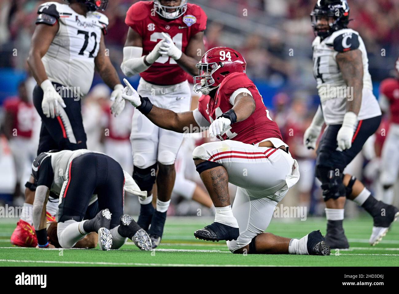 Cincinnati Bearcats quarterback Desmond Ridder (9) is sacked by Alabama