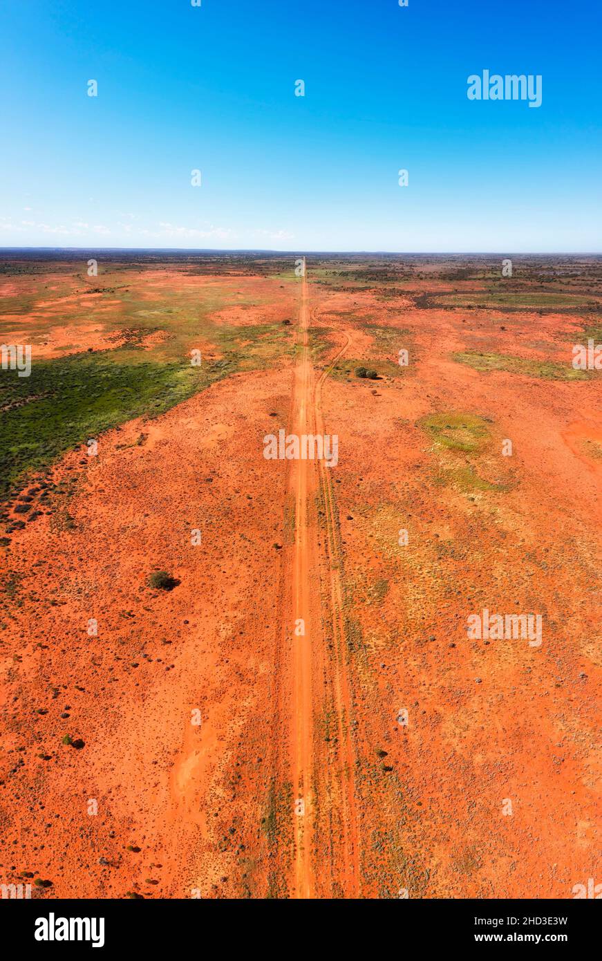 Endless plains of Australian outback semi desert around Broken hill in overhead vertical aerial panorama along dirt track. Stock Photo