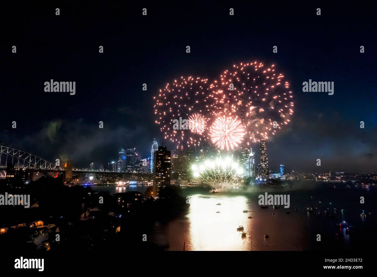 Light show of Sydney city New Year eve fireworks over CBD at midnight