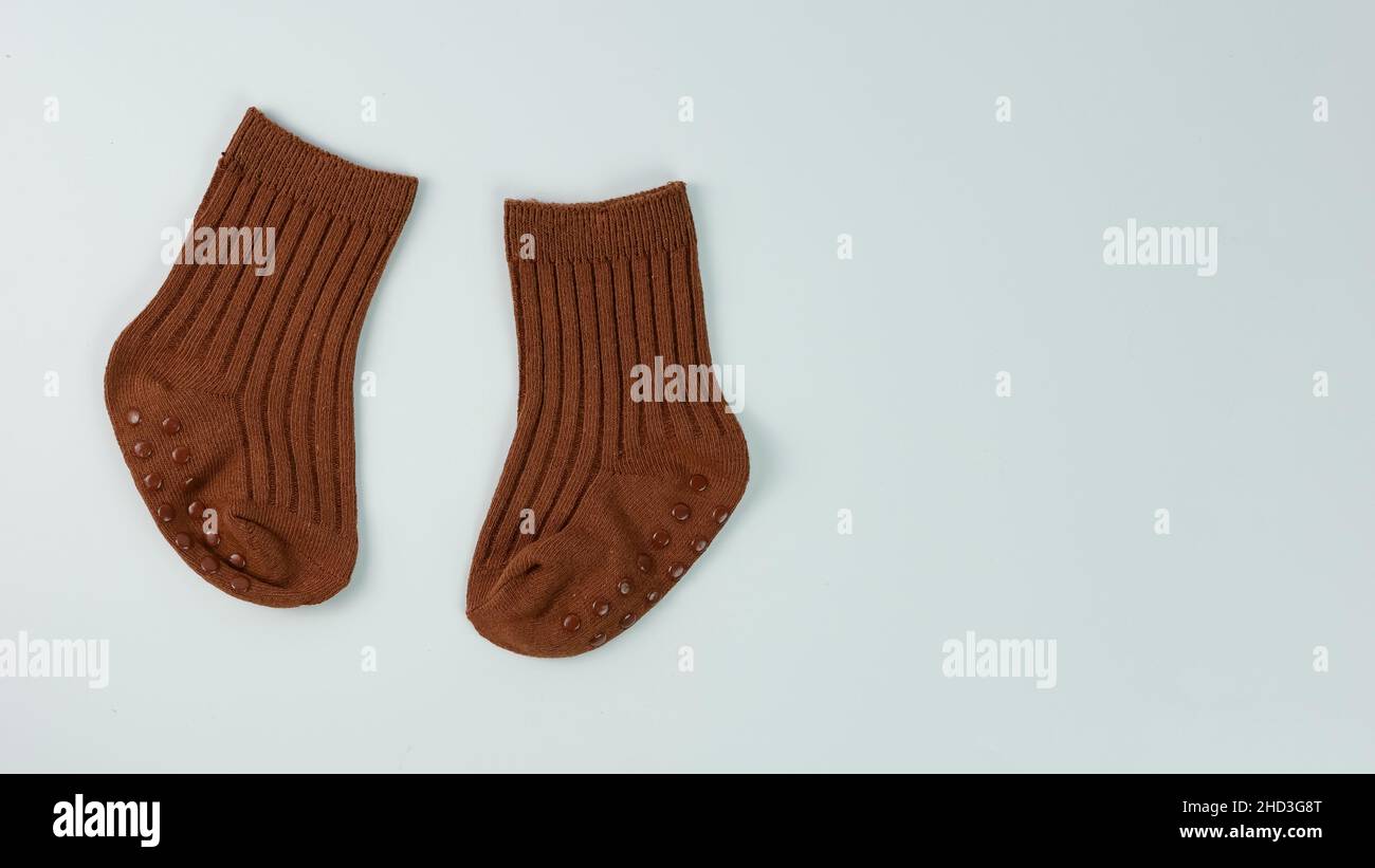 a pair of cute little baby socks isolated on white background. Stock Photo