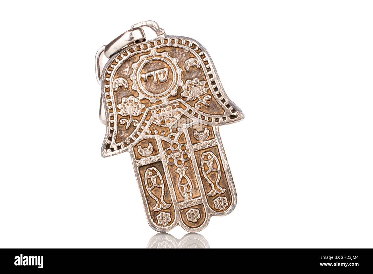 One metal keychain, Jewish 'hand of Miriam', close-up, isolated on white. Stock Photo