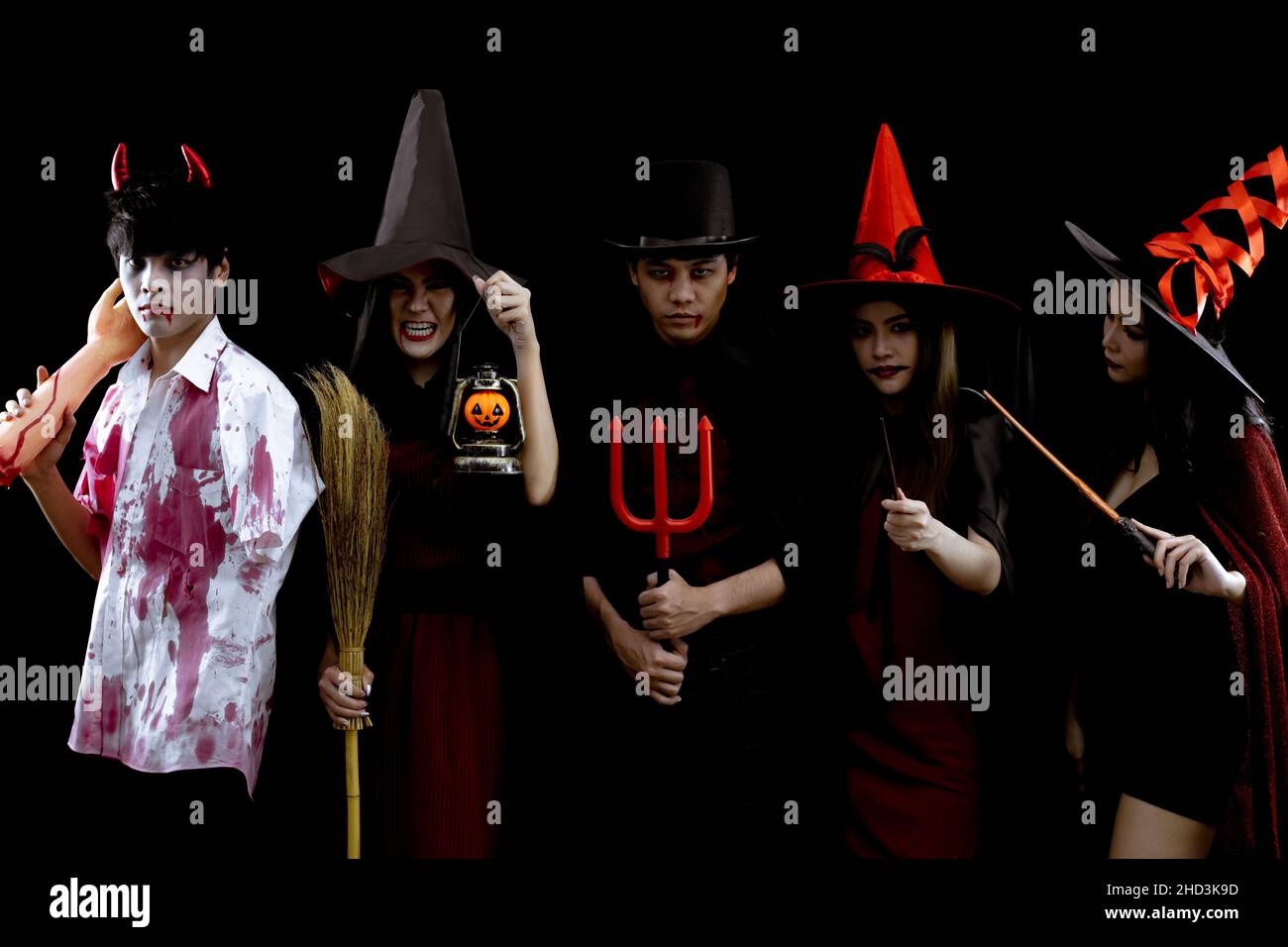 Group young Asian in costume Halloween party on black background with concept for Halloween fashion festival in studio. Gang of teen Asian in cosplay Stock Photo