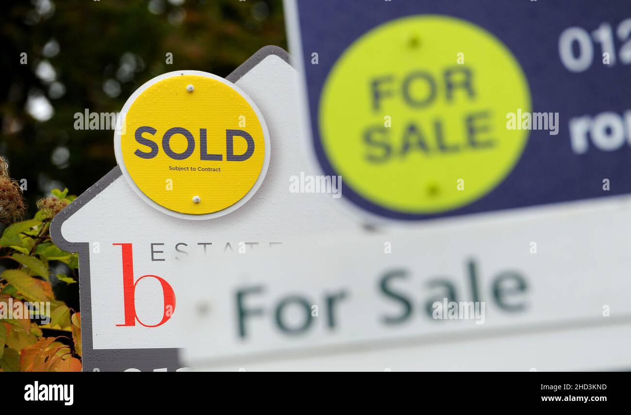 File photo dated 14/10/14 of estate agents boards. The year ahead could bring more stability to the housing market, after a bumper year in 2021 saw frenzied homebuyer activity and prices surging to record highs. Issue date: Monday January 3, 2022. Stock Photo