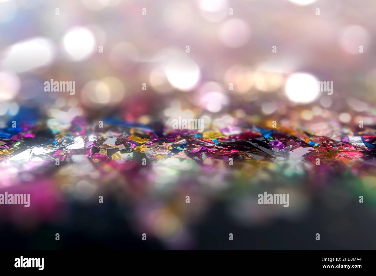 Falling colorful confetti with blurred light background Stock Photo - Alamy