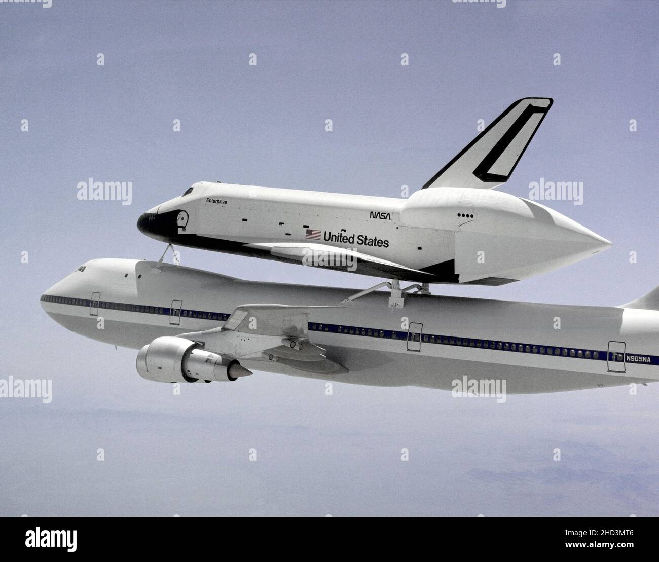 The Space Shuttle Enterprise, the nation's prototype space shuttle orbiter, departed NASA's Dryden Flight Research Center, Edwards, California, at 11:00 a.m., 16 May 1983, on the first leg of its trek to the Paris Air Show at Le Bourget Airport, Paris, France. Carried by the huge 747 Shuttle Carrier Aircraft (SCA), the first stop for the Enterprise was Peterson AFB, Colorado Springs, Colorado. Piloting the 747 on the Europe trip were Joe Algranti, Johnson Space Center Chief Pilot, Astronaut Dick Scobee, and NASA Dryden Chief Pilot Tom McMurtry. Flight engineers for that portion of the flight w Stock Photo