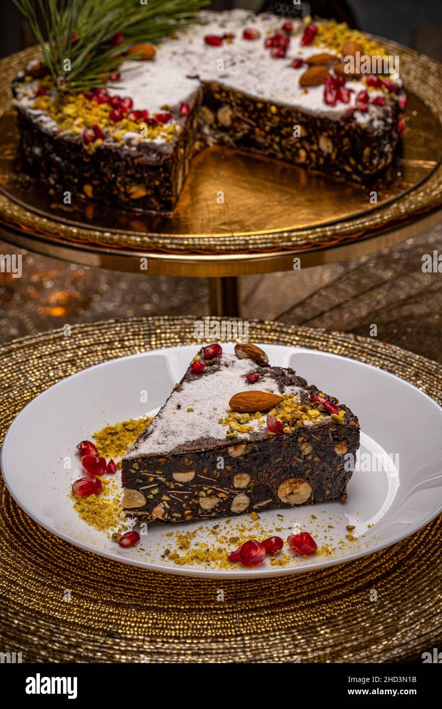 Raw vegan chocolate cake with pistachio, almond and nuts Stock Photo