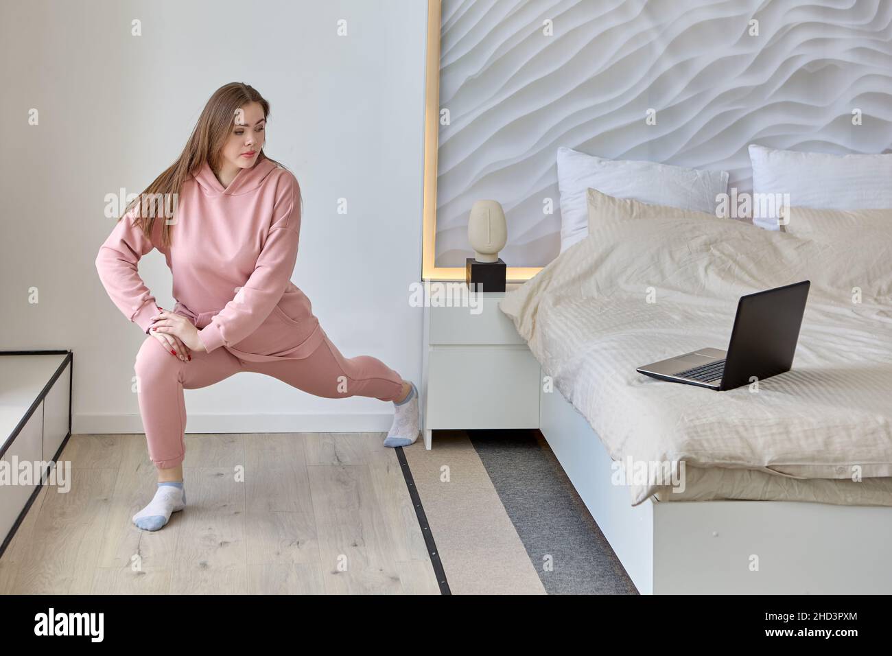 Live streaming virtual classes using laptop by woman indoors. Stock Photo