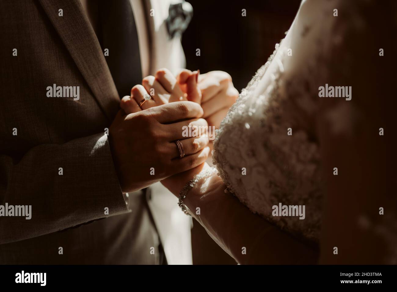 Bride and groom holding hands Stock Photo