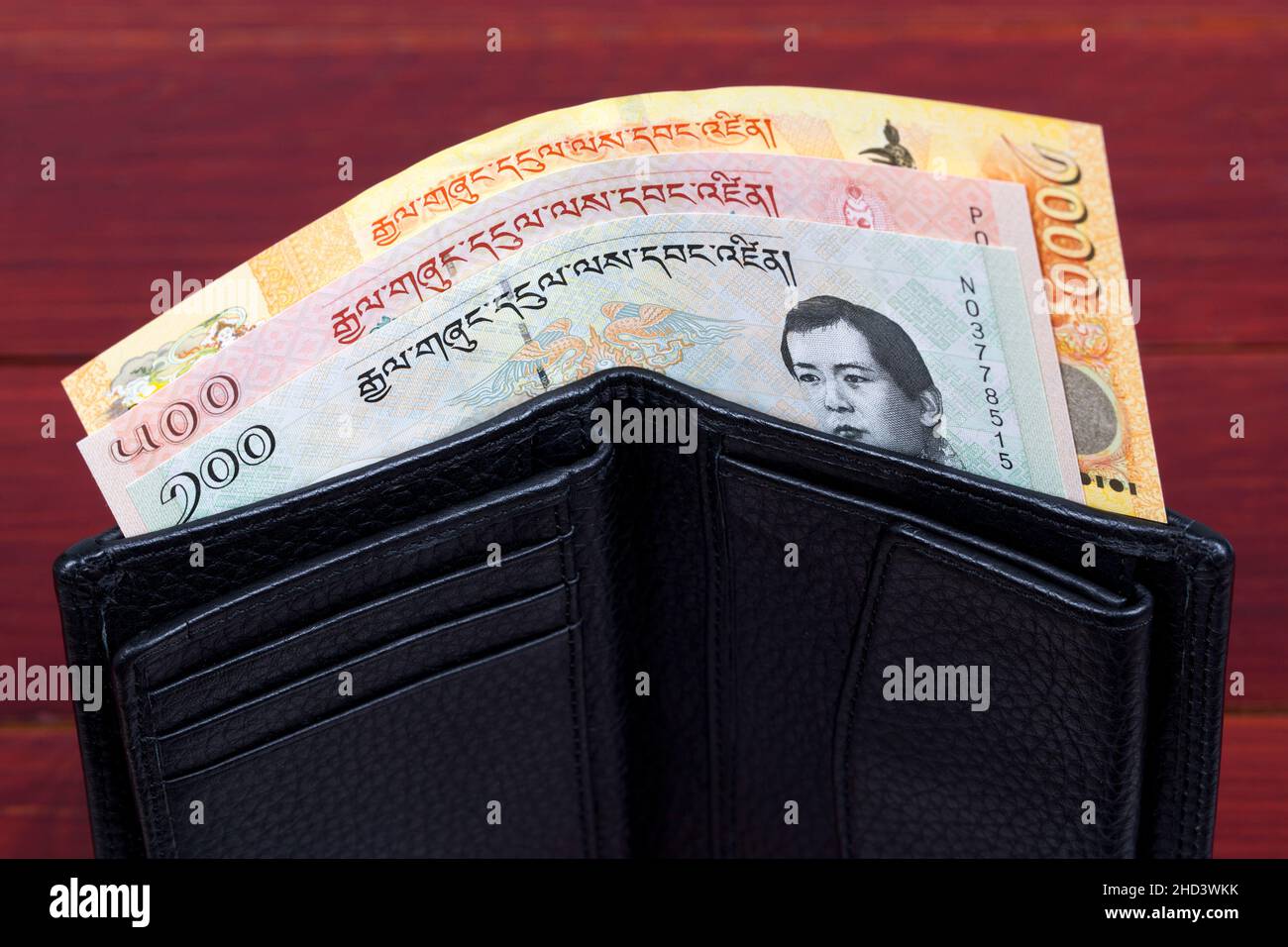Bhutanese money -  ngultrum in the black wallet Stock Photo