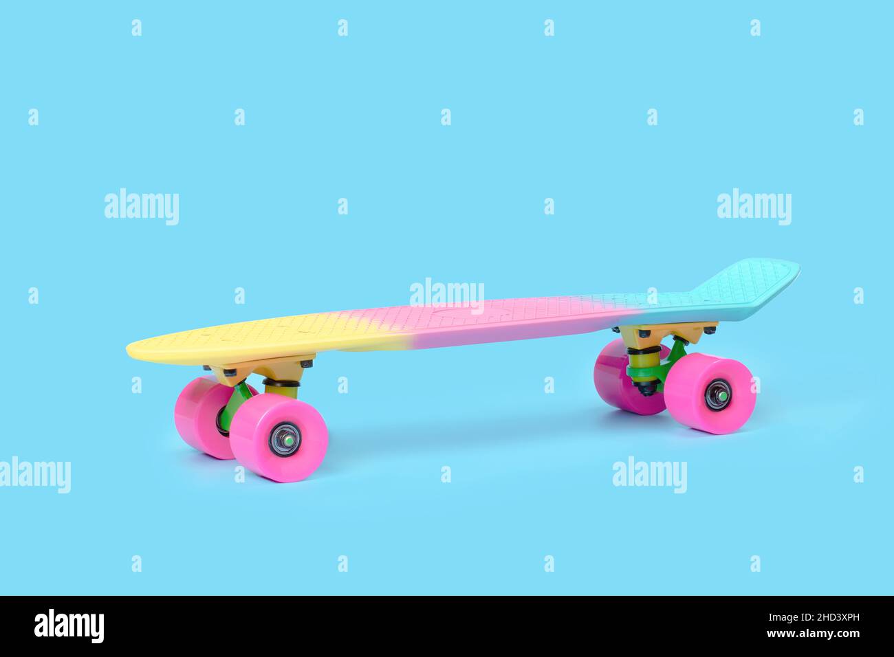 Blue plastic mini cruiser penny board or skate board with yellow and orange  wheels in an alley with light at the end Stock Photo - Alamy