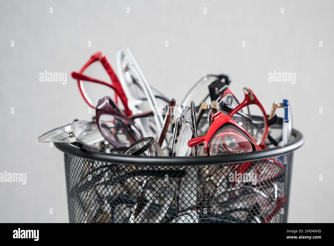 Pile of colourful eyesight glasses lies in rubbish bin Stock Photo Alamy