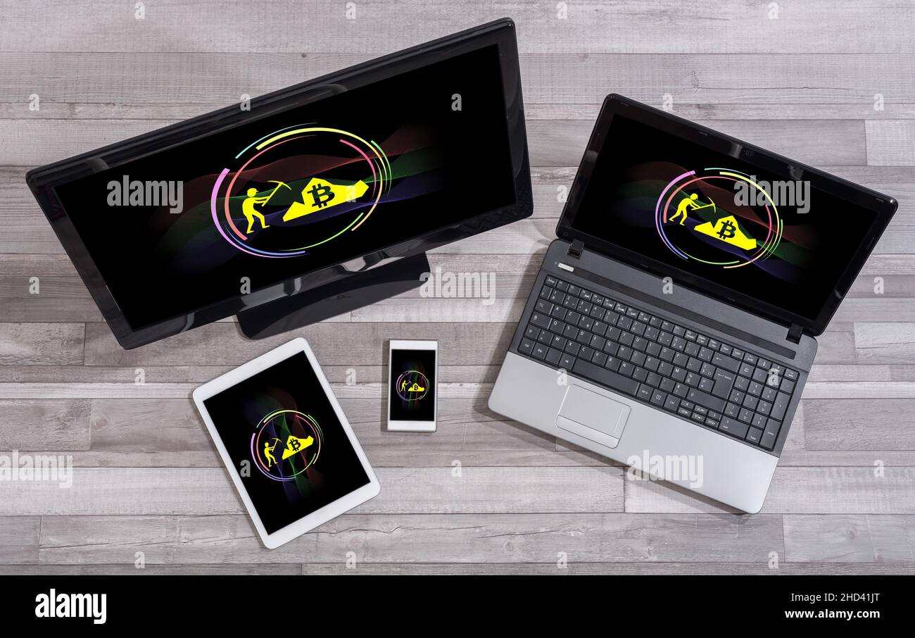 Bitcoin mining concept shown on different information technology devices Stock Photo