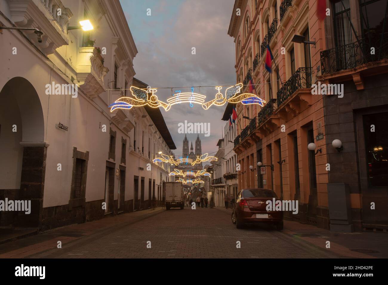 Quito, Pichincha, Ecuador - January 1 2022: Tourists walking at sunset through the streets with Christmas decorations of the historic center of the ci Stock Photo