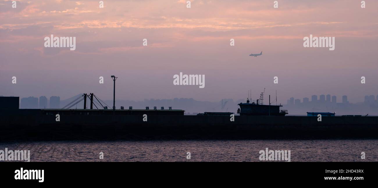 Scenic view of the port of Dalian on bright sunset sky background Stock Photo