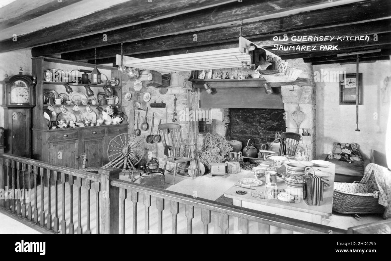 Vintage postcard entitled “Old Guernsey Kitchen, Saumarez Park”. Depicting a reproduction of an old Guernsey kitchen, a display at Guernsey's Folk & Costume Museum at Saumarez Park on the island of Guernsey, Channel Islands. Stock Photo