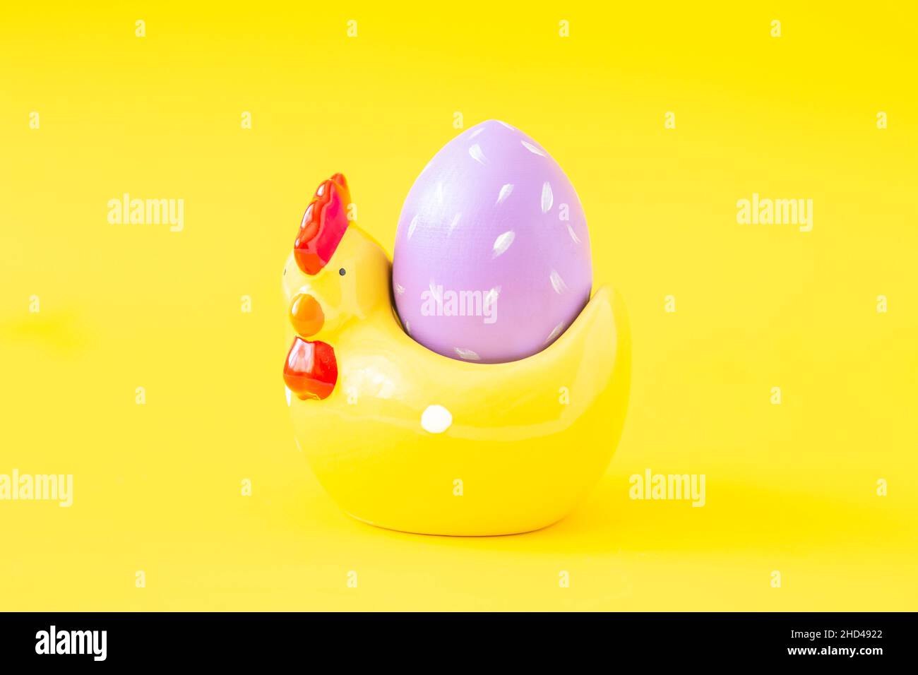 Easter greeting card with decorative chicken and painted egg. Easter concept Stock Photo