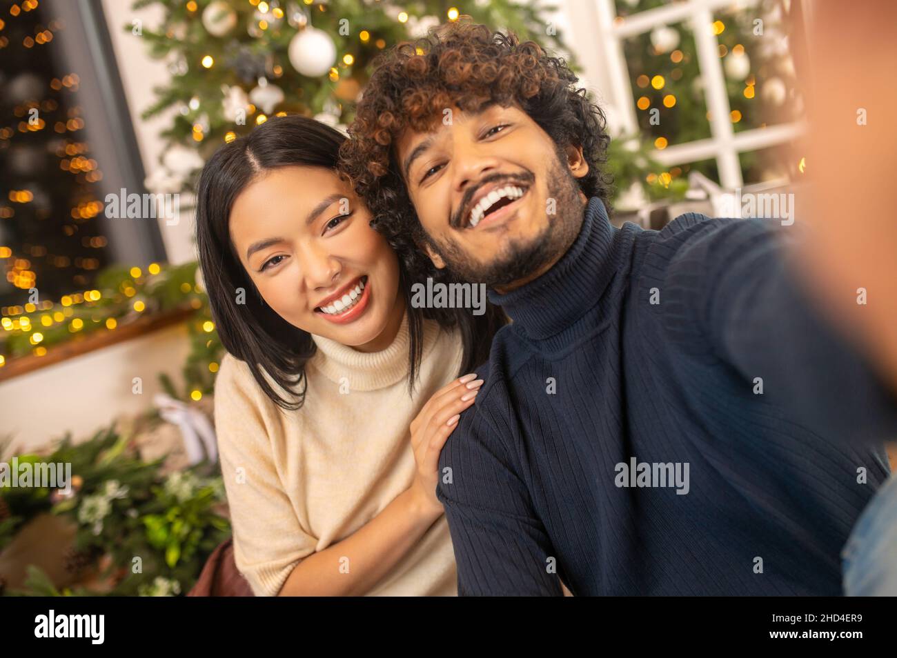Close-up man and woman smiling at camera Stock Photo