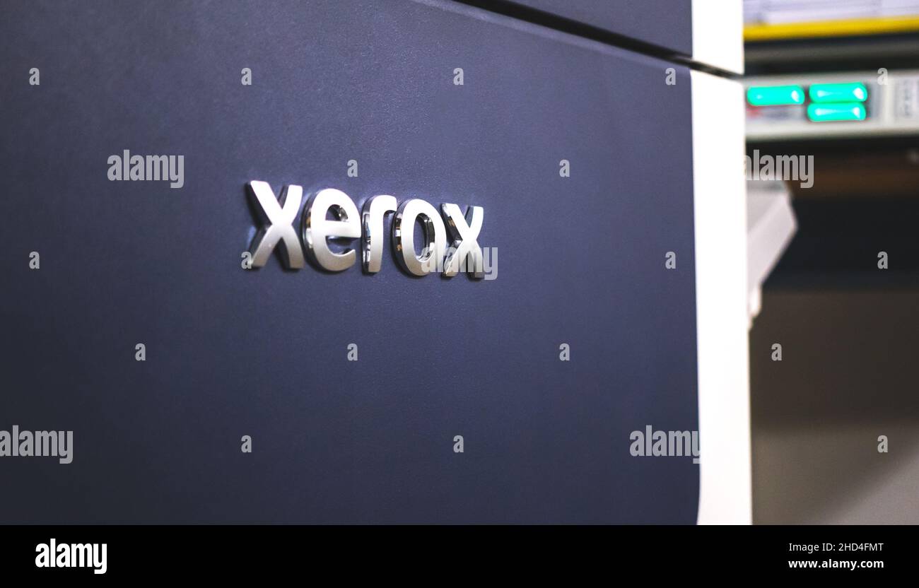 Kharkov, Ukraine - December 24, 2021: Xerox logo close-up. Large high volume printer in print house workshop Stock Photo