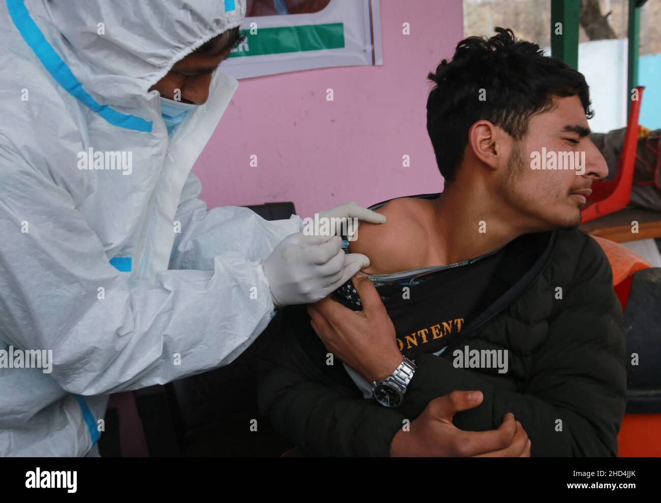 January 3, 2022, Srinagar, Jammu and Kashmir, India: A boy reacts as he receives a dose of Bharat Biotech's coronavirus disease (COVID-19) vaccine, Covaxin, during a vaccination drive for children aged 15-18 years in Srinagar, Indian-Kashmir. (Credit Image: © Sajad HameedZUMA Press Wire) Stock Photo