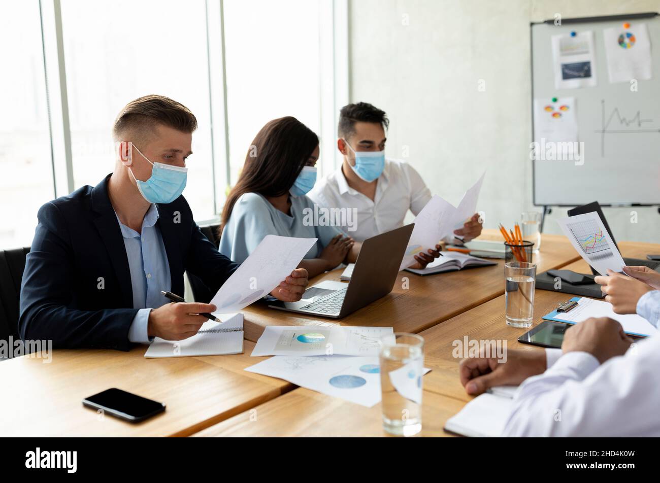 Group Of Multiethnic Colleagues Wearing Protective Face Masks Working ...