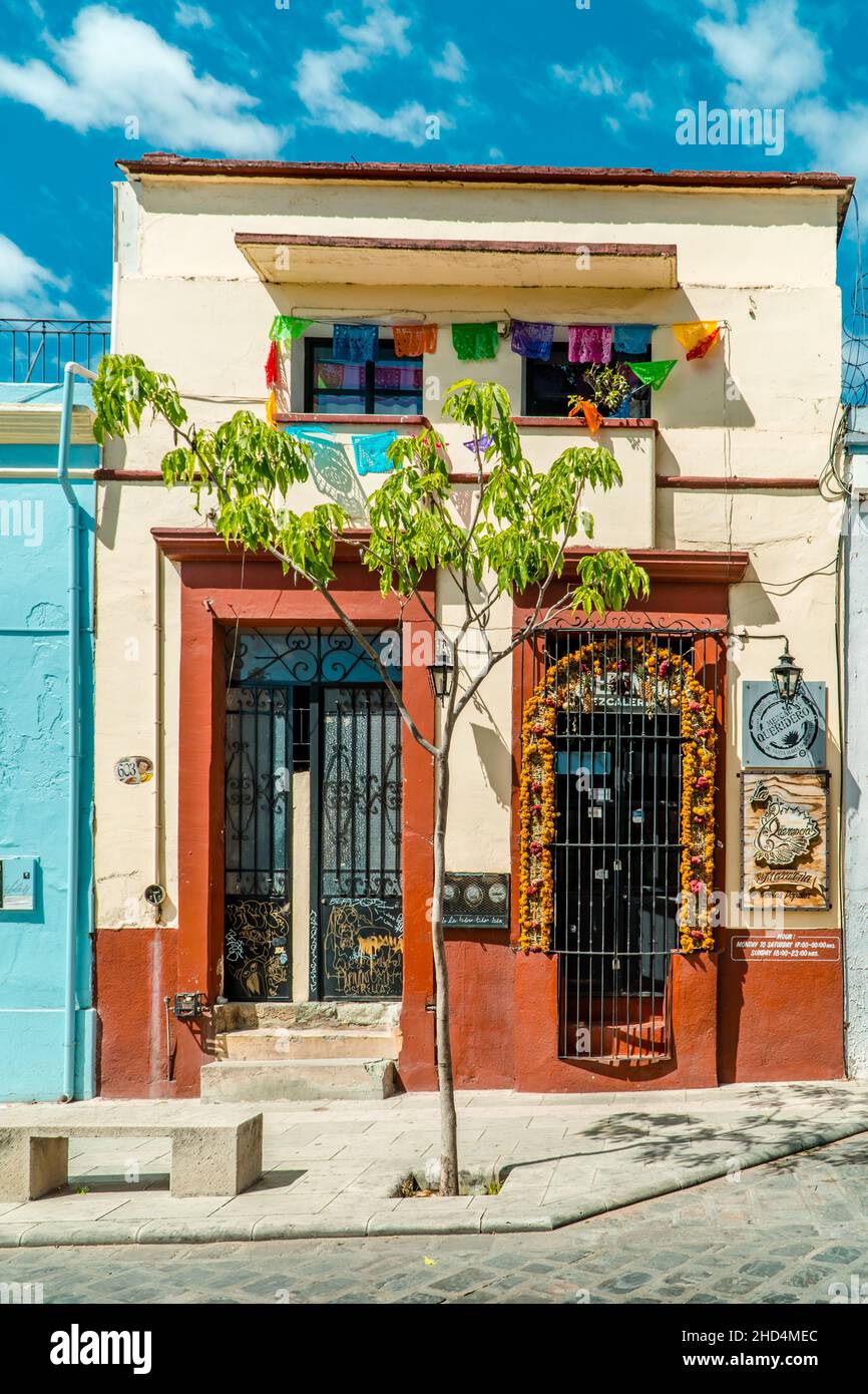 Colorful colonial architecture and Day of the Dead decorations in the historic center of Oaxaca Stock Photo