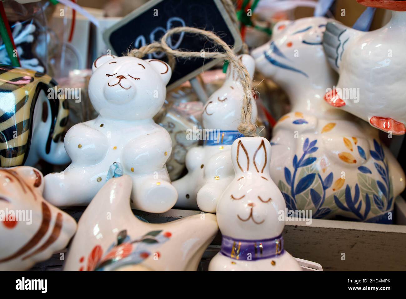 Moscow, Russia - 20 December 2021, Glass Christmas toys hares and bears for the Christmas tree at the fair Stock Photo