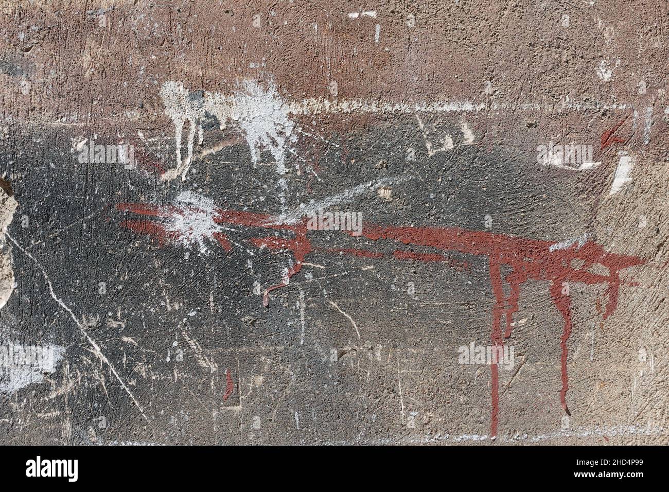 Abstract paint smudges and scratches on textured wall background. Stock Photo