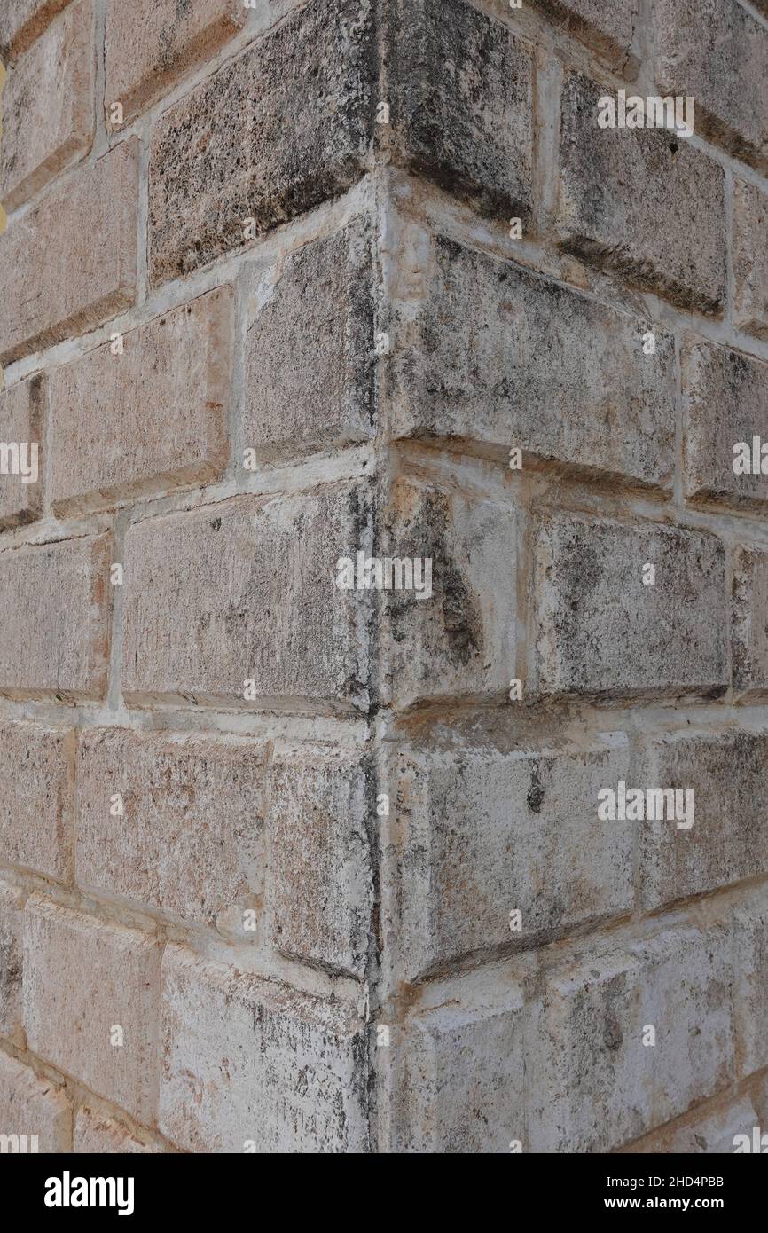 Old stone block wall corner. Architectural detail. Stock Photo