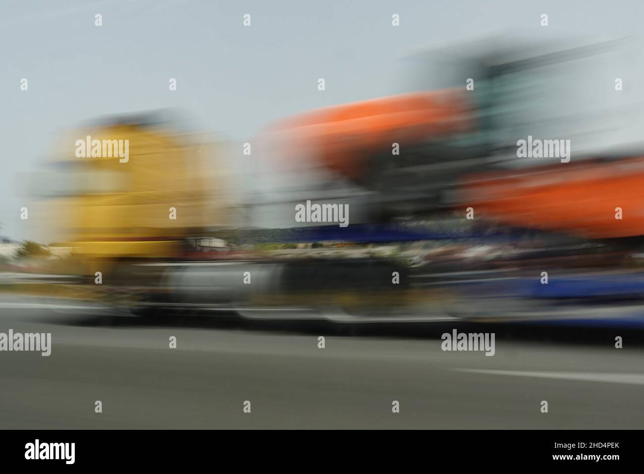 Transport truck vehicle in motion on the highway. Abstract long exposure blur. Stock Photo