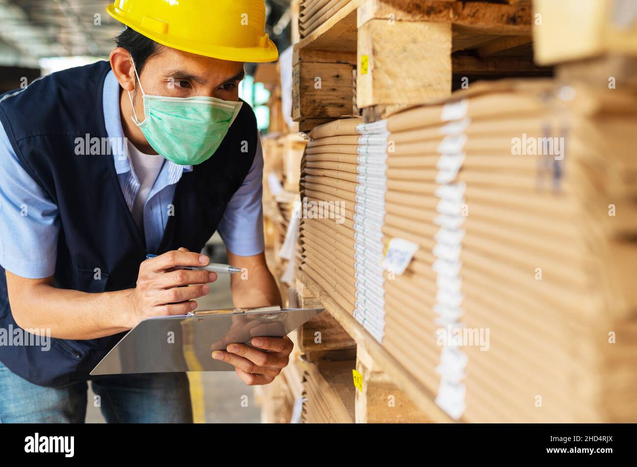 Worker checking raw material in store for factory industrial, Safety
