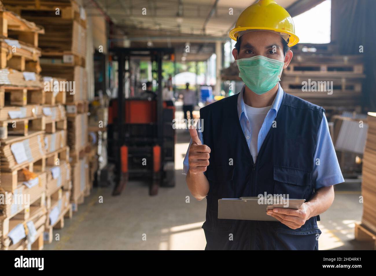Worker checking raw material in store for factory industrial, Safety