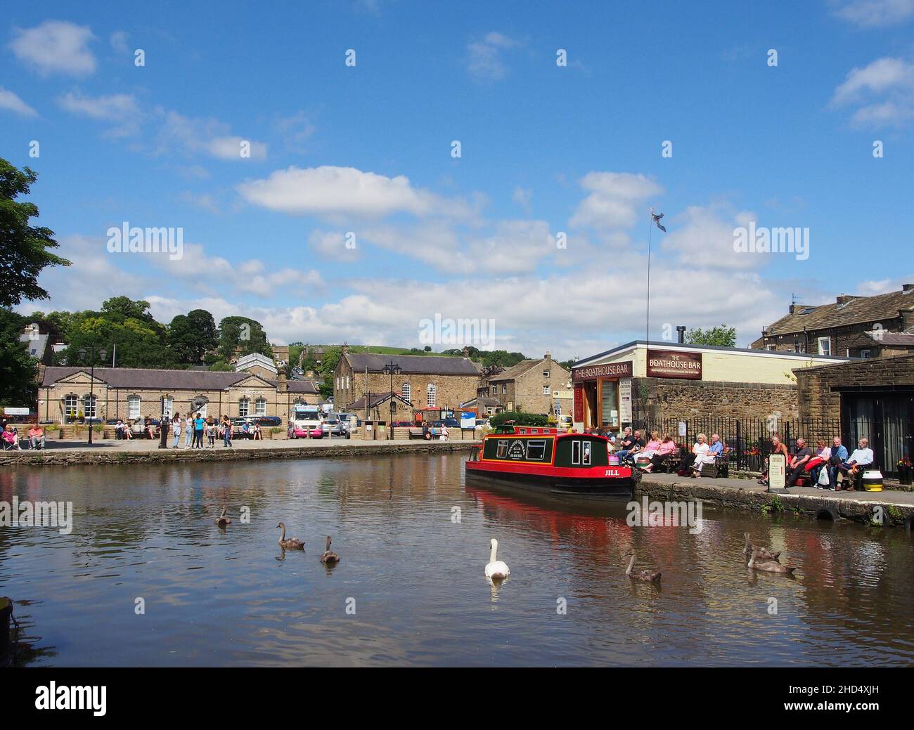 Tourists enjoying the sunshine at Skipton canal basin in Yorkshire, England. Stock Photo