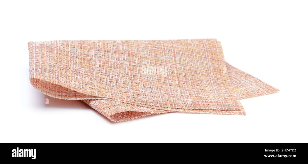 Sintetic folded kitchen napkin isolated on white. Stock Photo