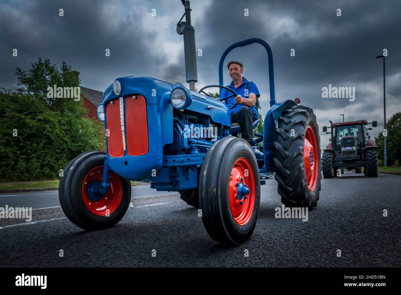 An old Fordson tractor in a fun run at Ashby de la Zouch. Stock Photo