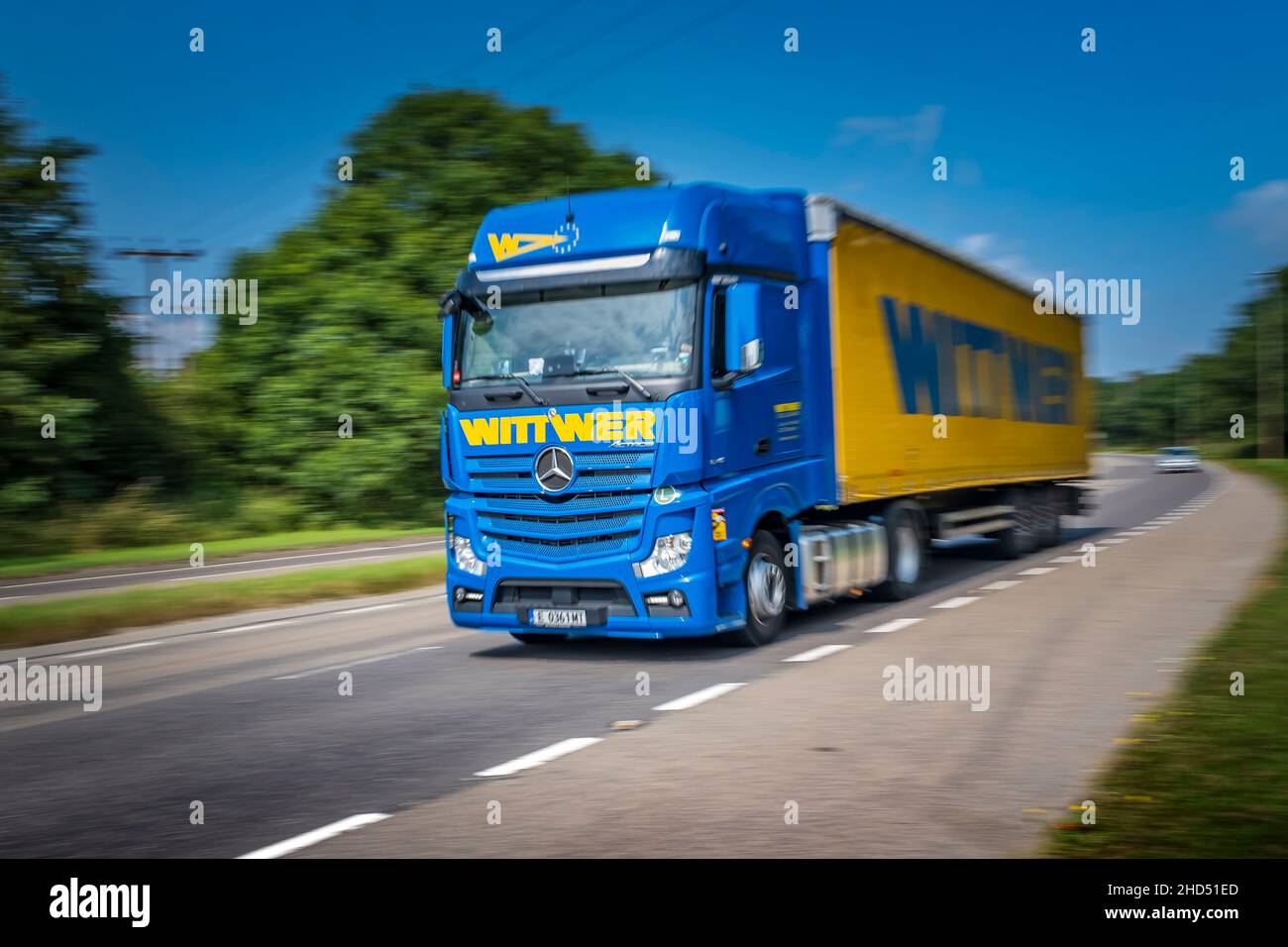 A Wittwer Spedition and Logistik GmbH articulated lorry at speed on a dual carriageway. Stock Photo