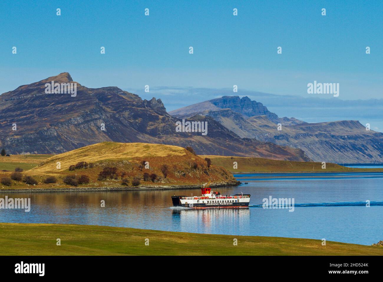 A CalMac ferry from Raasay comes into Sconser with the Trotternish peninsula in the distance. Stock Photo
