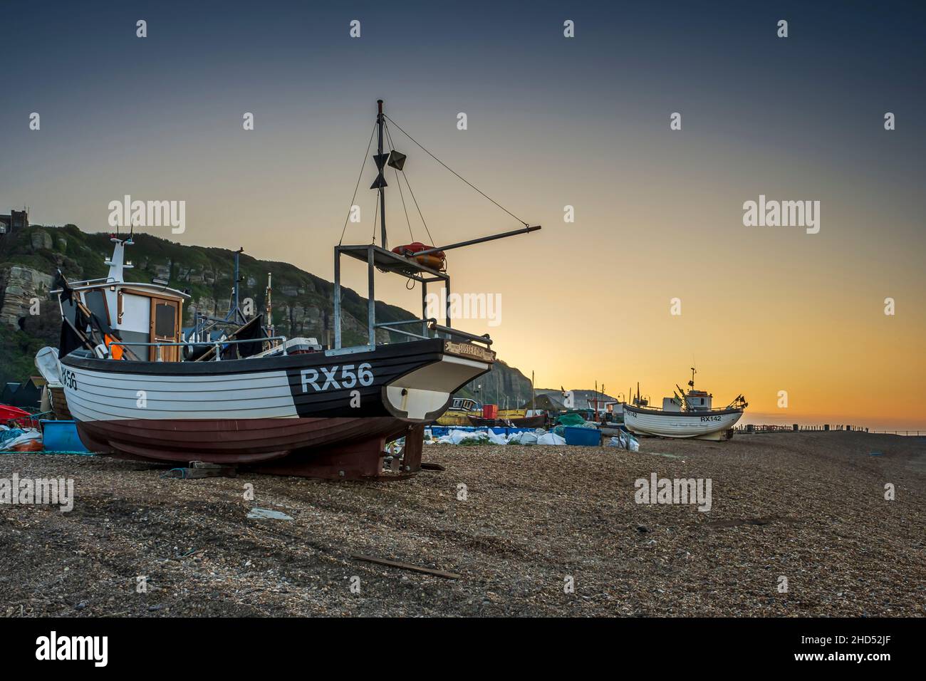 The fishing fleet on The Stade at Hastings at sunrise. Stock Photo