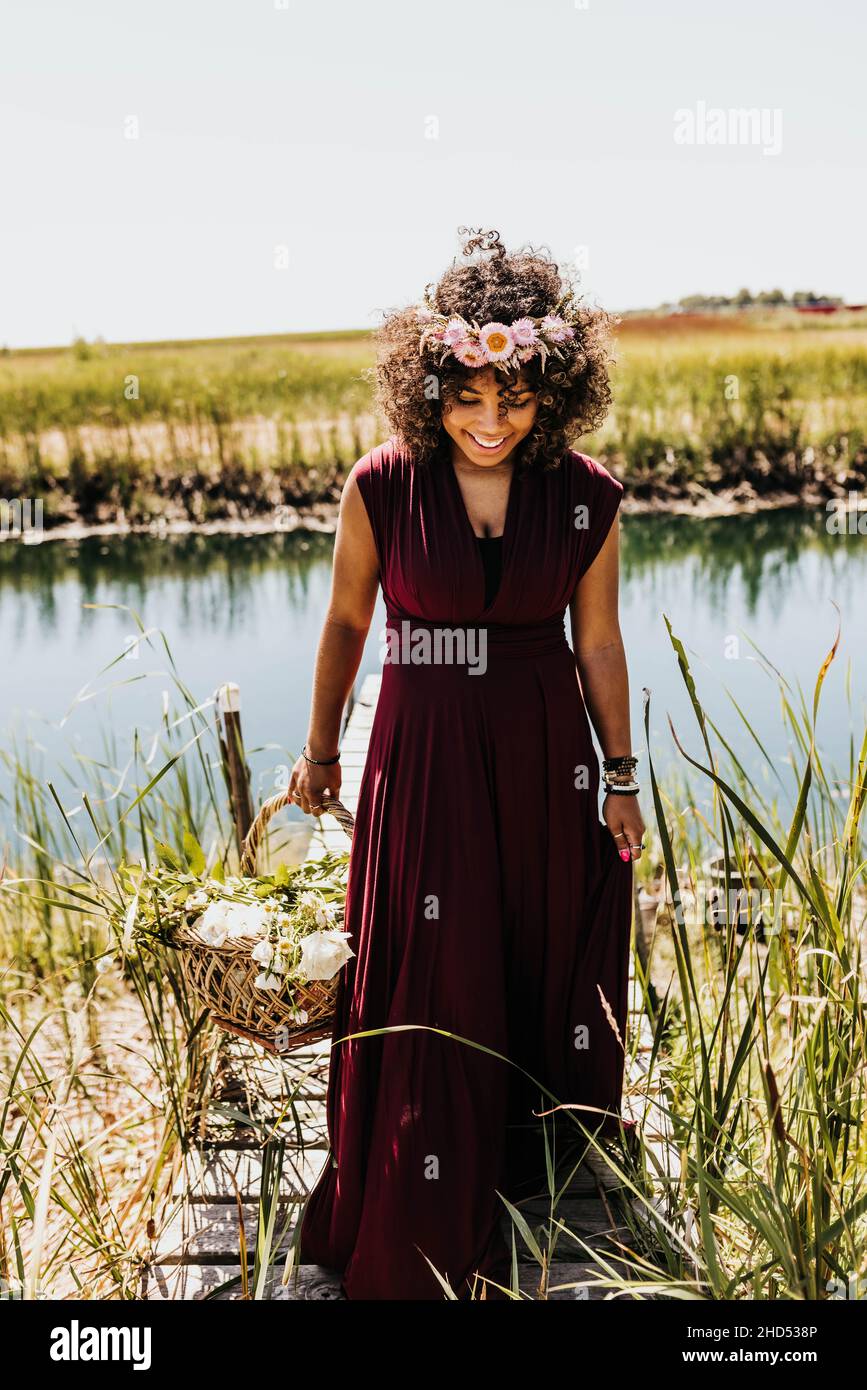 Close up of black woman looking down while walking off dock Stock Photo