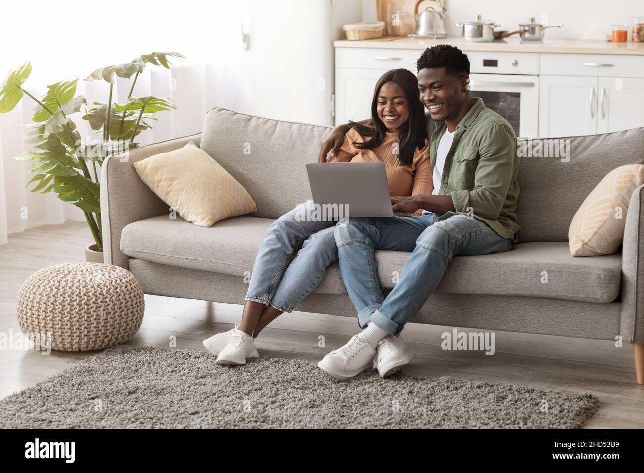 Loving black family sitting hi-res stock photography and images - Alamy
