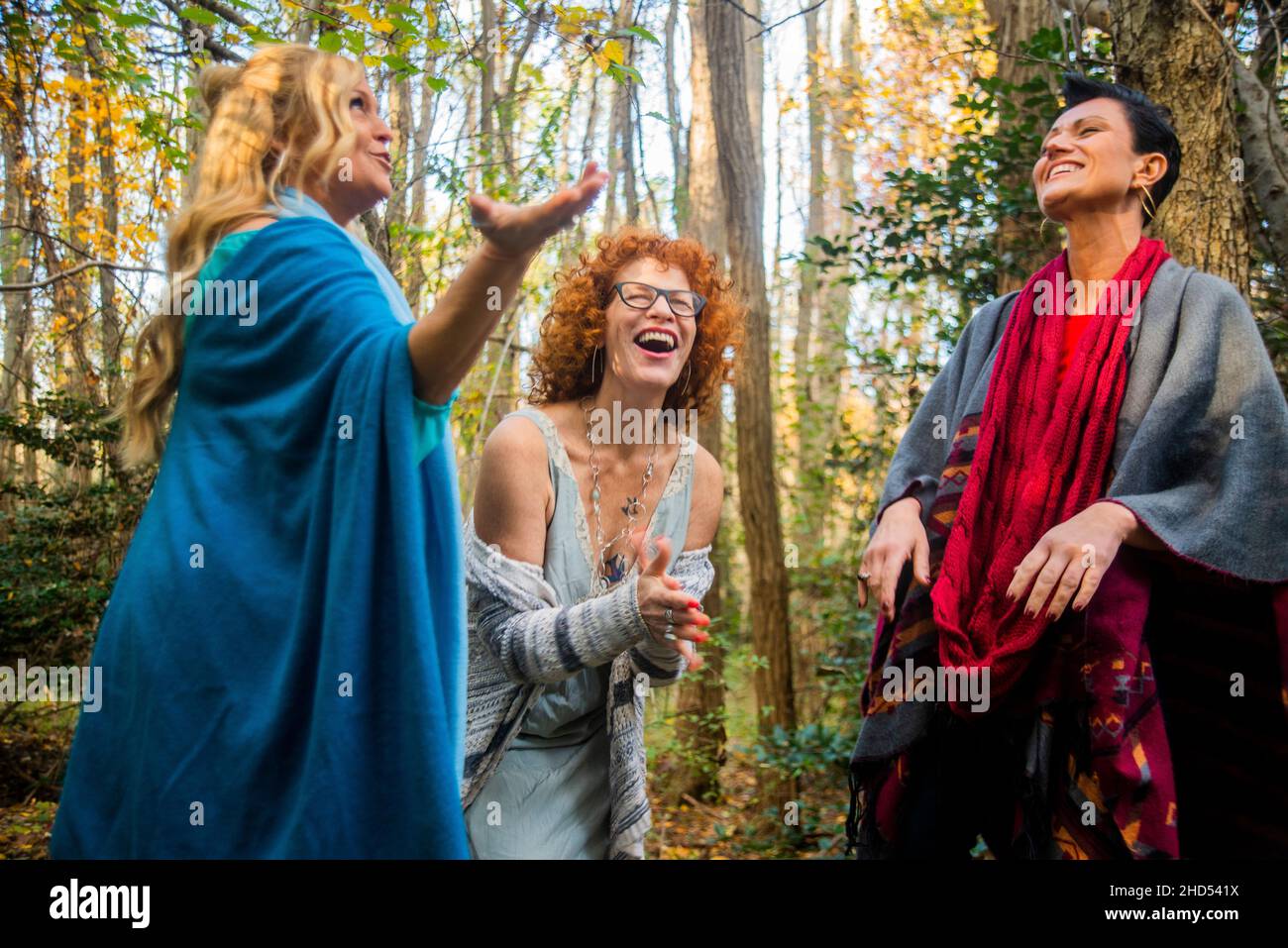Women laughing in the woods Stock Photo