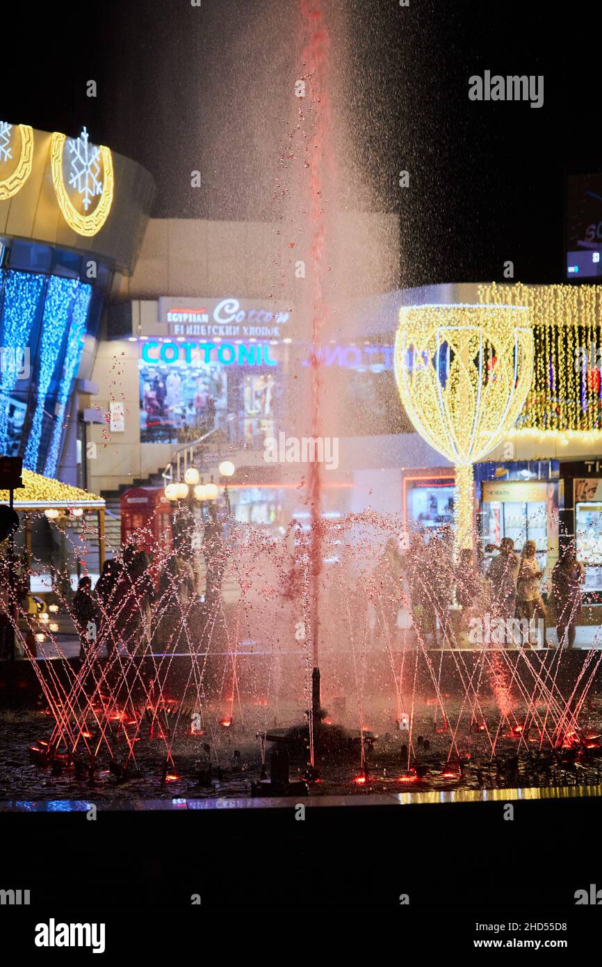 Sharm El Sheikh, Egypt - November 20, 2021: Night colorful light-musical fountain at modern building of Culturama cinema in popular shopping center Stock Photo