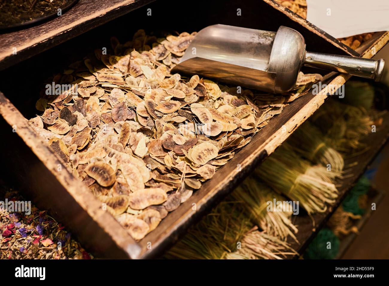 Sharm El Sheikh, Egypt - November 20, 2021: Egyptian dried herbal tea in the wooden box at the street market in the  Soho Square Stock Photo