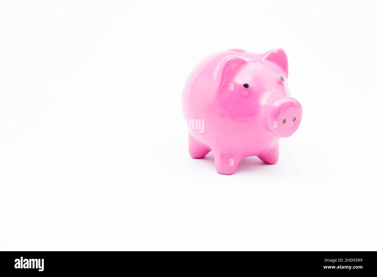 Pink piggy bank on isolated white background Stock Photo - Alamy