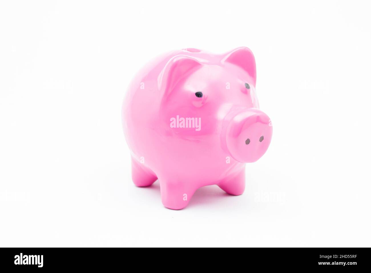 Pink piggy bank on isolated white background Stock Photo - Alamy