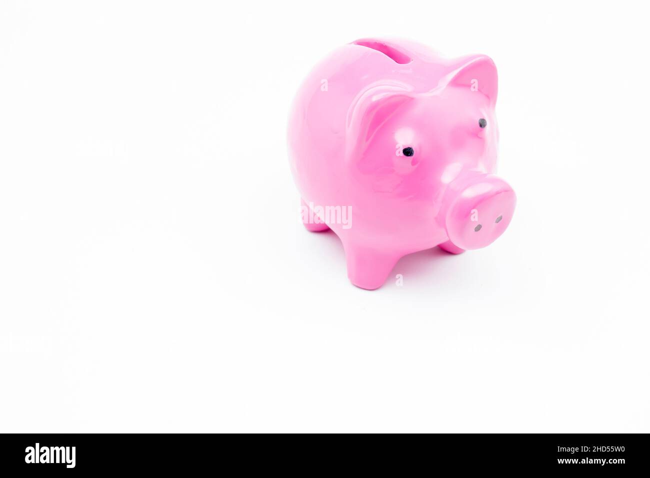Pink piggy bank on isolated white background Stock Photo - Alamy