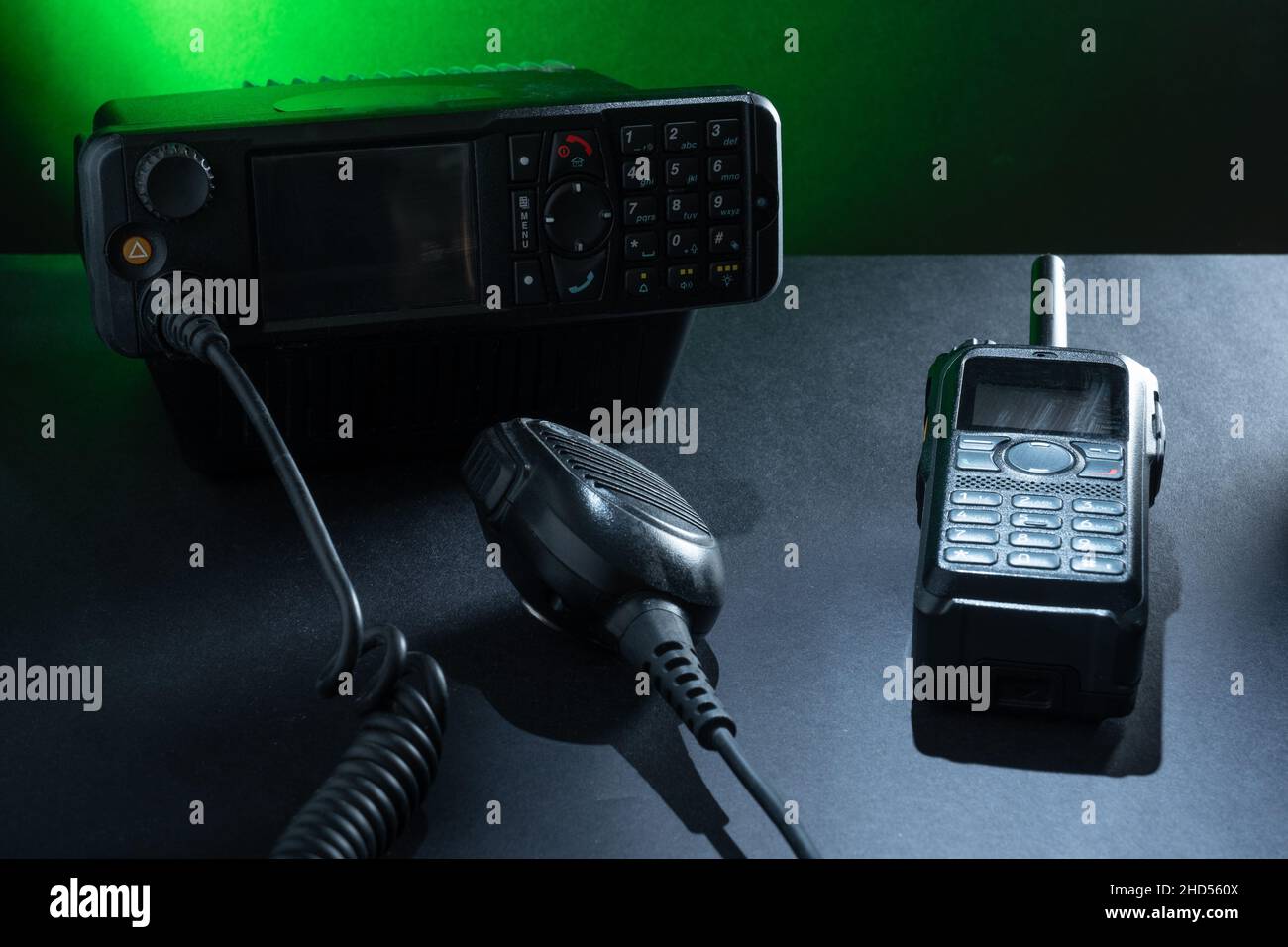 Helsinki / Finland - JANUARY 3, 2022: Closeup of pair of mobile two-way radios for Amateur radio operators against a dark background. Stock Photo