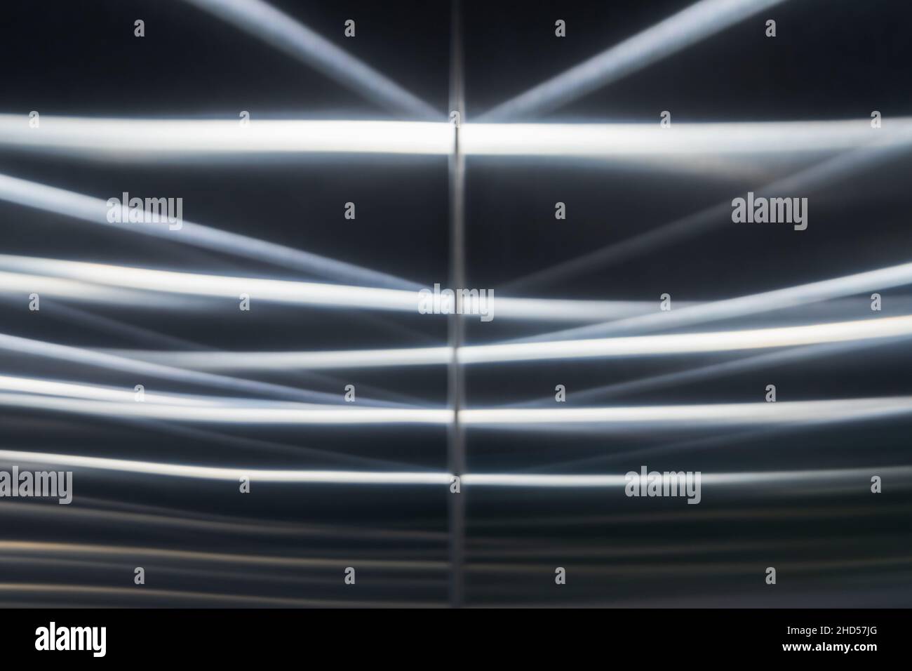 Brushed steel wall with blurred reflections pattern, abstract ...