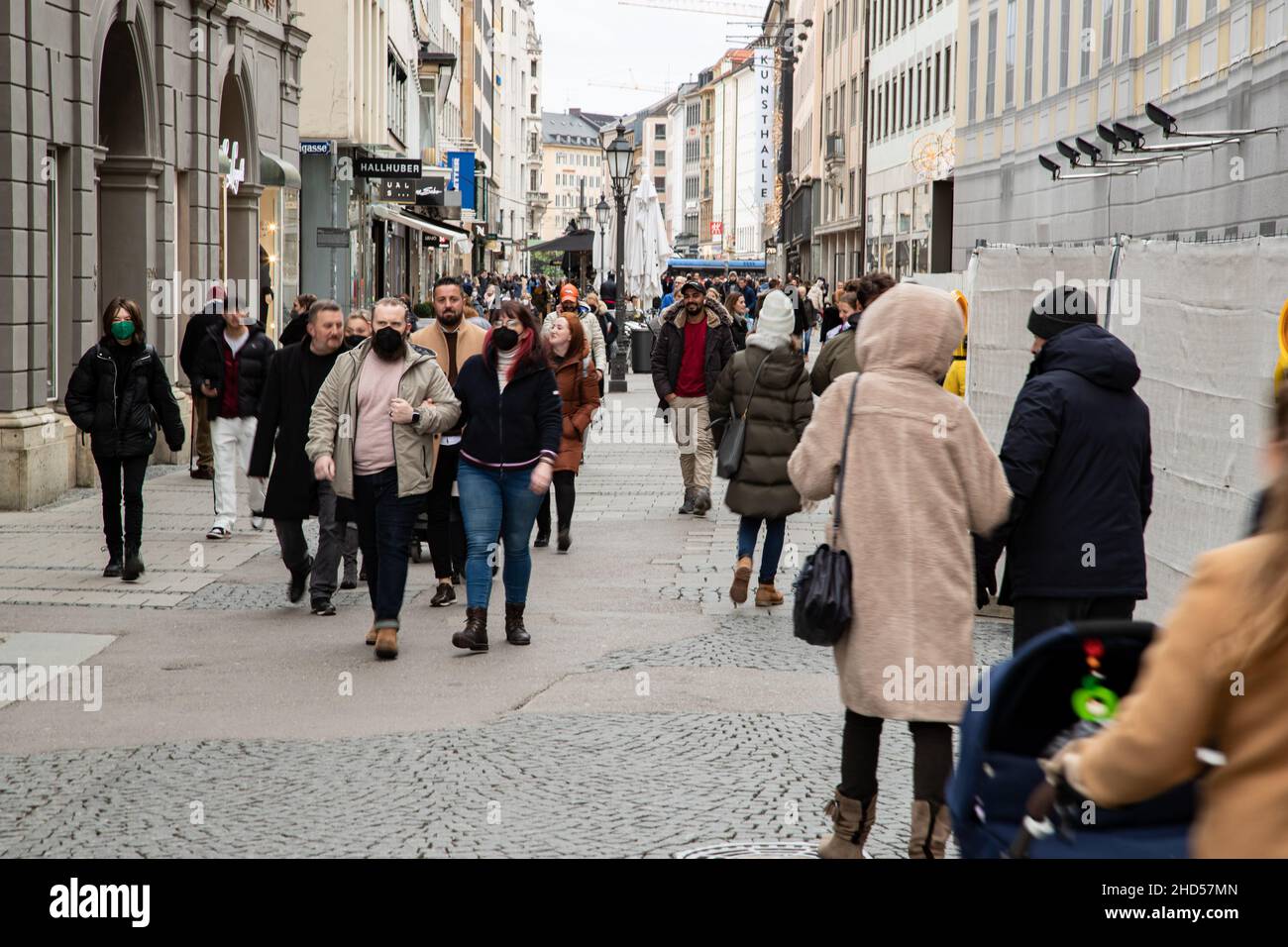 People go shopping in Munich, Germany on January 3rd, 2022. If one wants to go shopping clothes one doesn't have to be vaccinated anymore, but for other shops in the pedestrian zone
